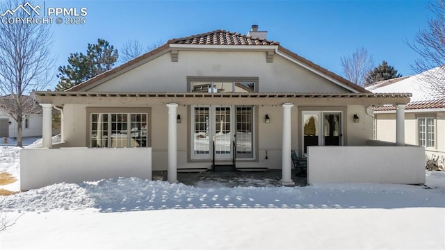 view of snow covered property