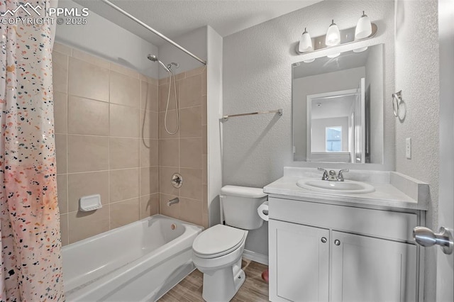 full bathroom with toilet, shower / bath combo with shower curtain, vanity, and hardwood / wood-style floors