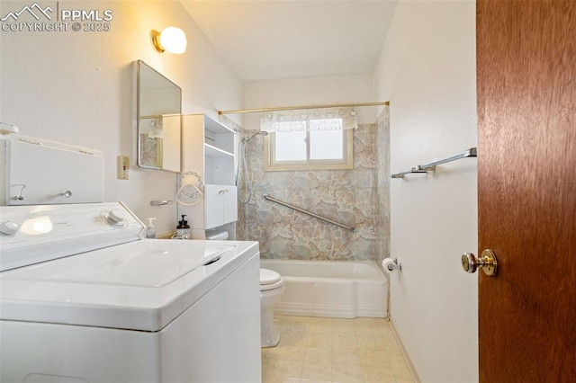 full bathroom with tiled shower / bath, vanity, toilet, and washer / dryer