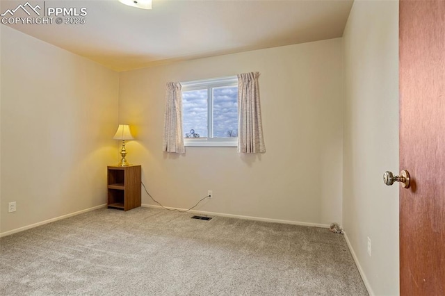 unfurnished room featuring carpet flooring