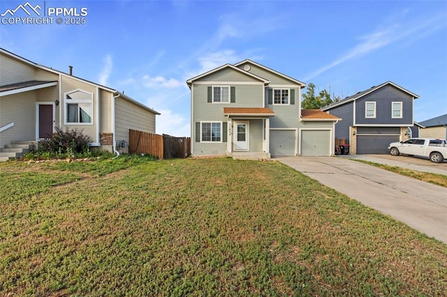 view of property featuring a front lawn and a garage