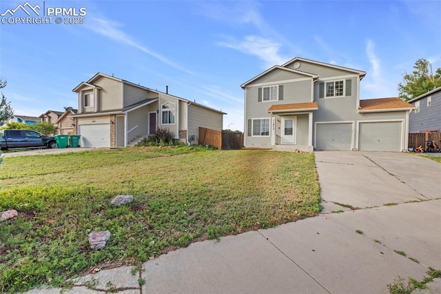 front facade featuring a front yard and a garage