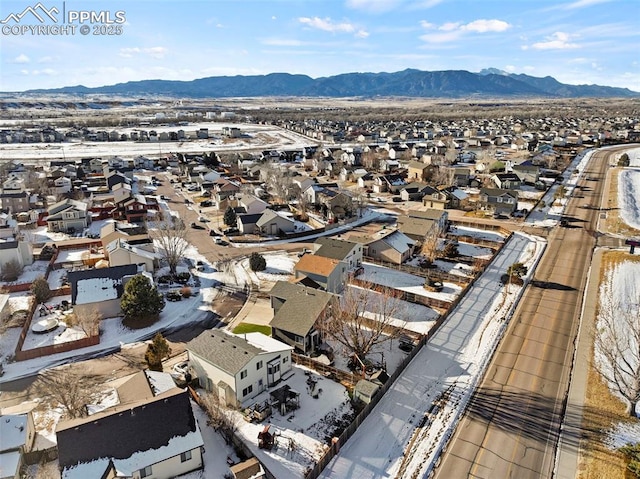 birds eye view of property with a mountain view