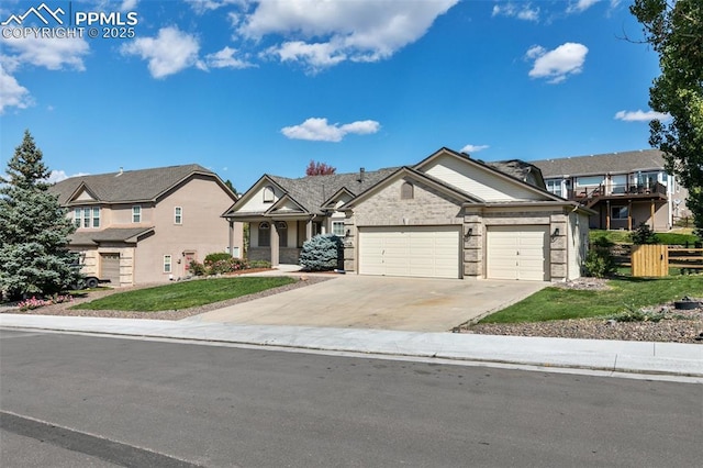 view of front of house featuring a garage and a front lawn