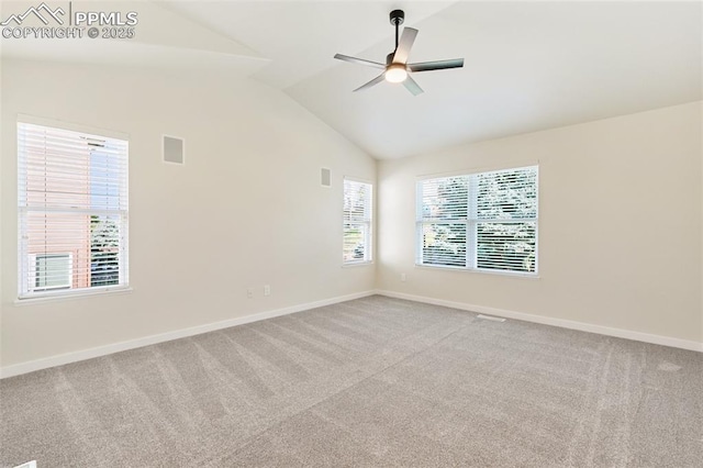 spare room with ceiling fan, plenty of natural light, and carpet floors