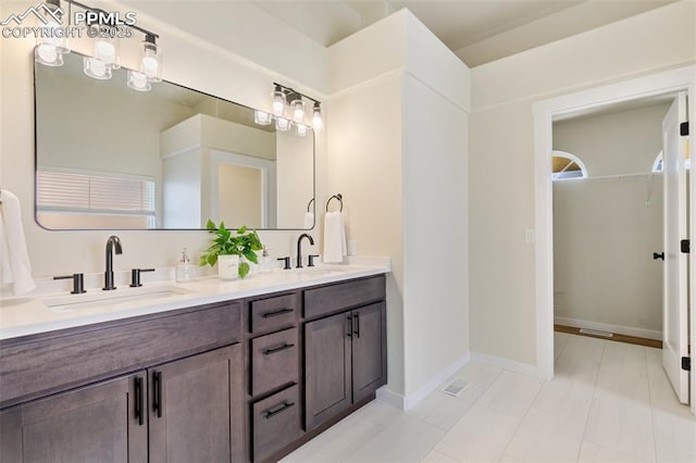 bathroom with vanity and tile patterned flooring