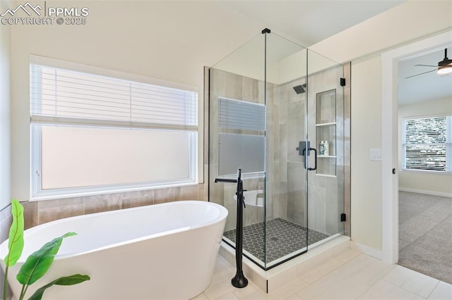 bathroom featuring ceiling fan, tile patterned floors, and plus walk in shower