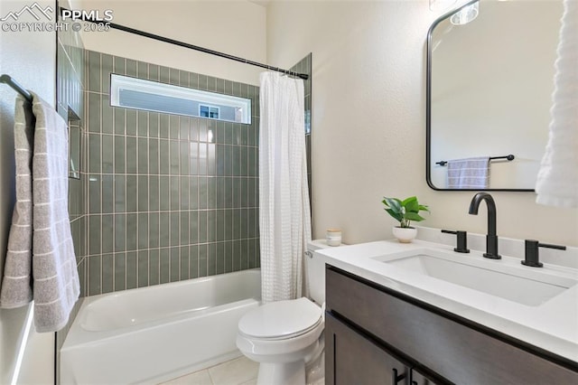 full bathroom featuring toilet, tile patterned flooring, vanity, and shower / bath combo with shower curtain