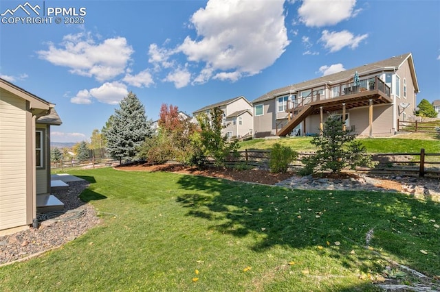 view of yard featuring a wooden deck