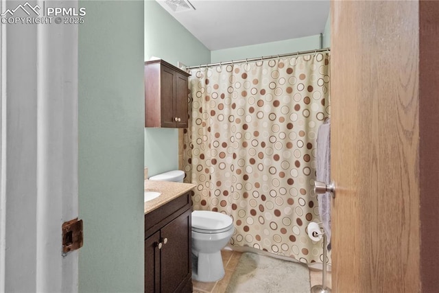 bathroom with toilet, walk in shower, and vanity