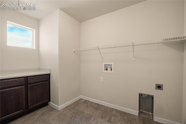 laundry area with cabinets, washer hookup, and hookup for an electric dryer