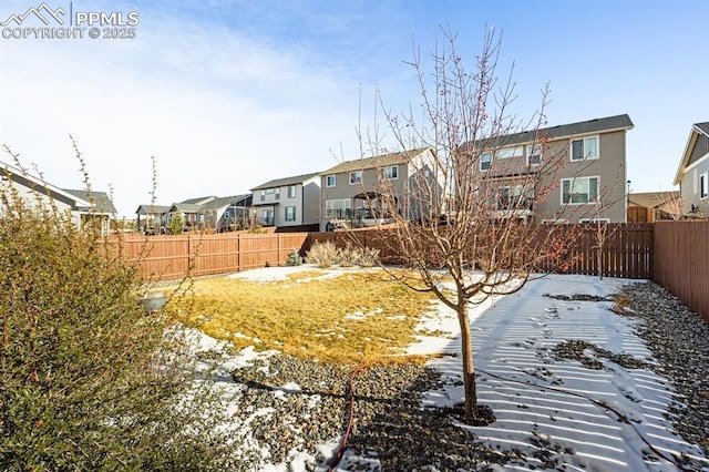 view of yard layered in snow