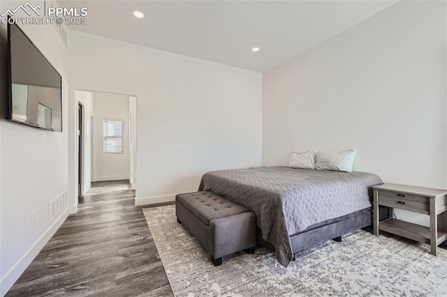 bedroom with hardwood / wood-style floors