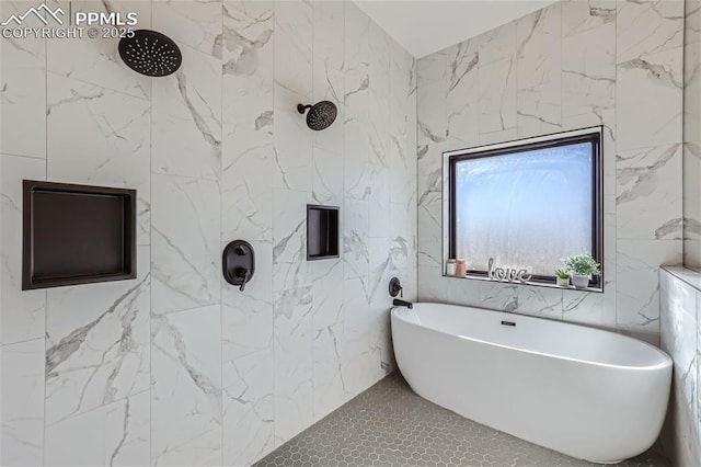 bathroom featuring shower with separate bathtub