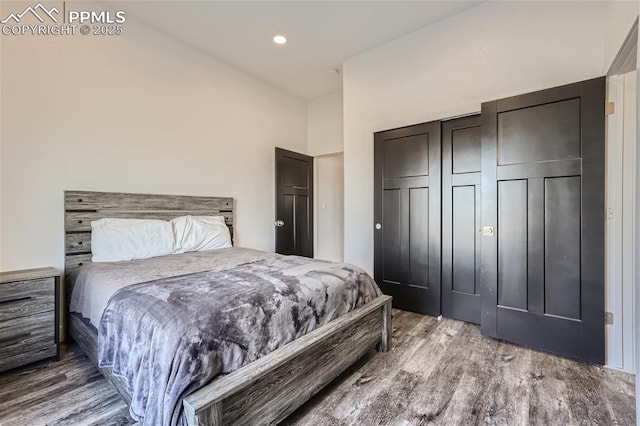 bedroom with hardwood / wood-style flooring