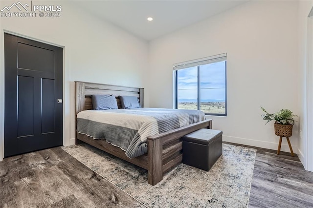 bedroom featuring dark hardwood / wood-style floors