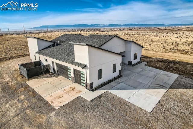 drone / aerial view featuring a mountain view