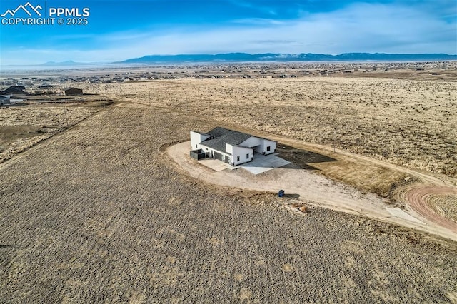 drone / aerial view featuring a mountain view