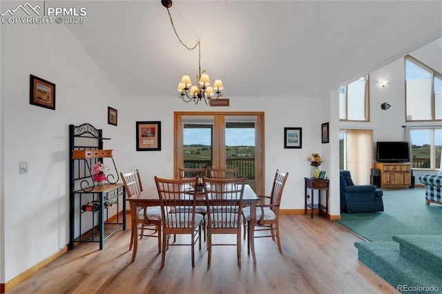 dining area featuring an inviting chandelier and wood-type flooring