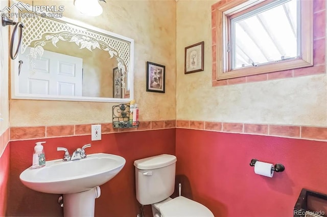 bathroom featuring sink and toilet