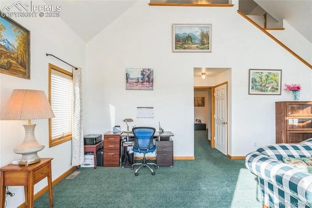 carpeted home office with lofted ceiling