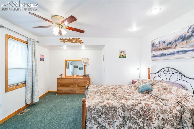 bedroom with dark colored carpet and ceiling fan