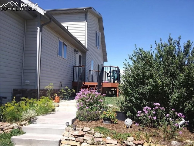 view of property exterior featuring a deck