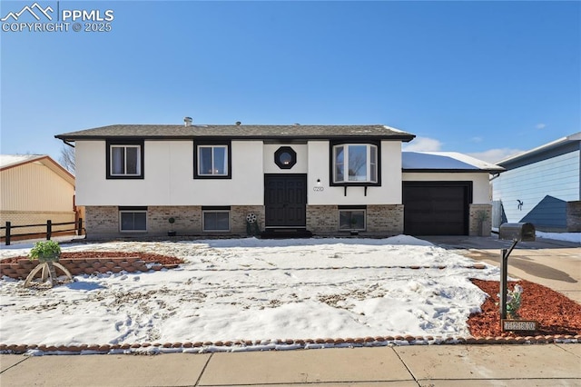 split foyer home featuring a garage