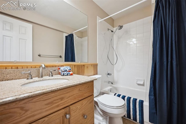 full bathroom featuring vanity, shower / bath combination with curtain, and toilet