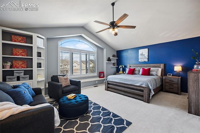 carpeted bedroom featuring lofted ceiling and ceiling fan