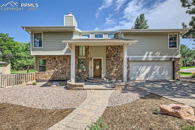 view of front of home with a garage and a porch