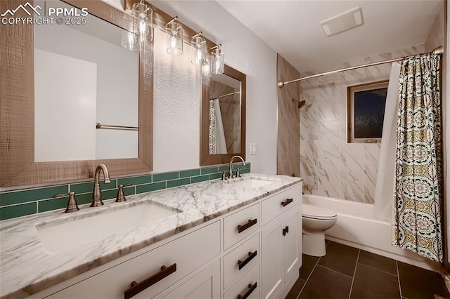 full bathroom with toilet, vanity, tile patterned floors, and shower / bath combo