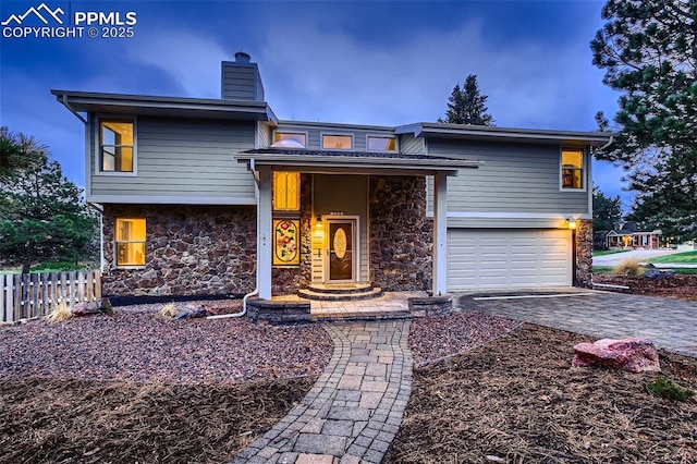 view of front of property with a garage