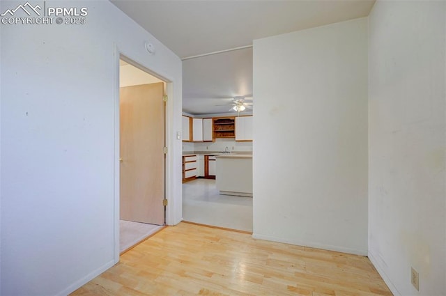 hall with light wood-type flooring