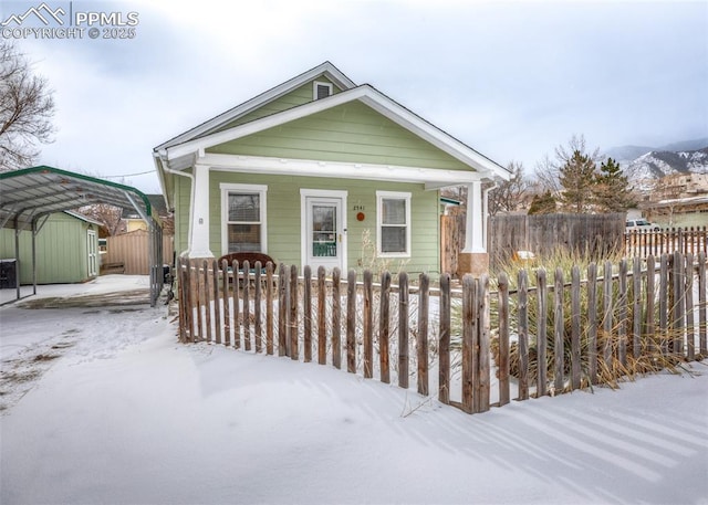 view of front of home featuring a carport