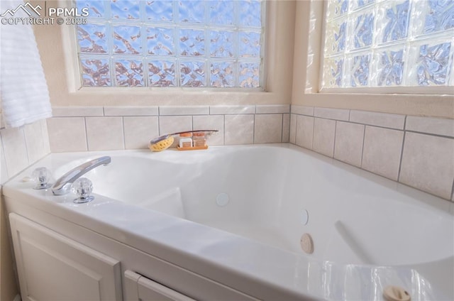 bathroom featuring tiled bath