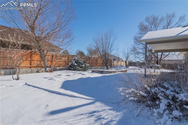 view of yard layered in snow