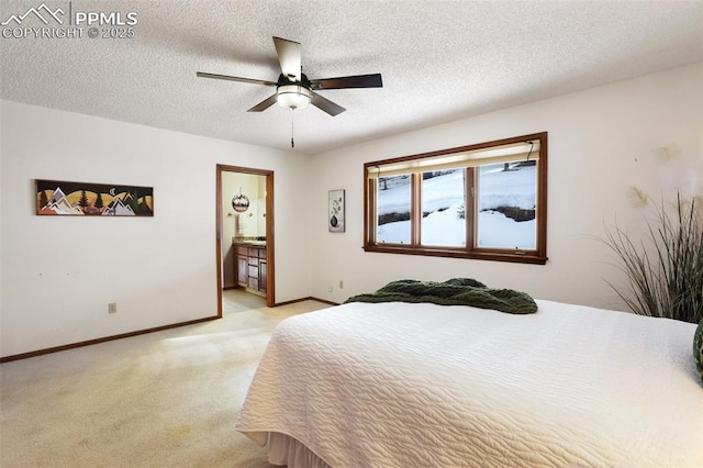 carpeted bedroom featuring ceiling fan, ensuite bathroom, and a textured ceiling