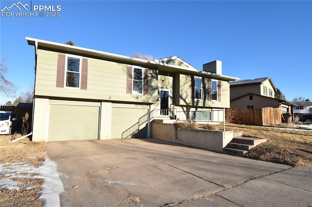 bi-level home featuring a garage