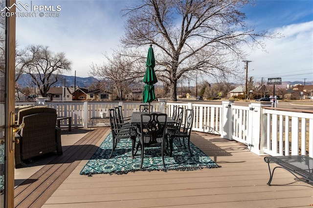 wooden deck featuring a mountain view