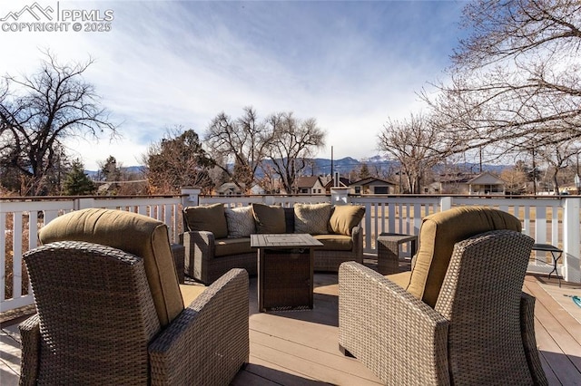 wooden terrace with outdoor lounge area