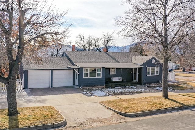 single story home featuring a garage