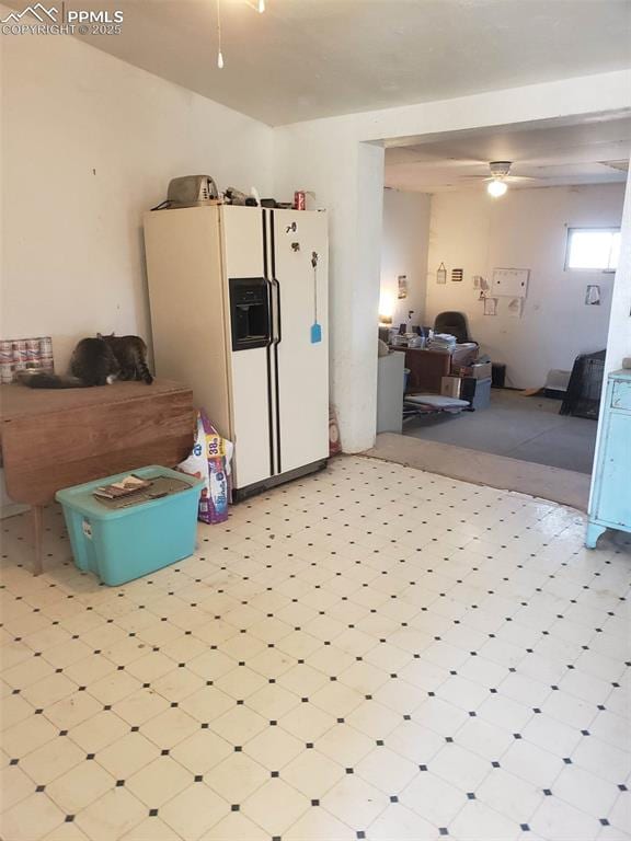 kitchen with ceiling fan and white refrigerator with ice dispenser