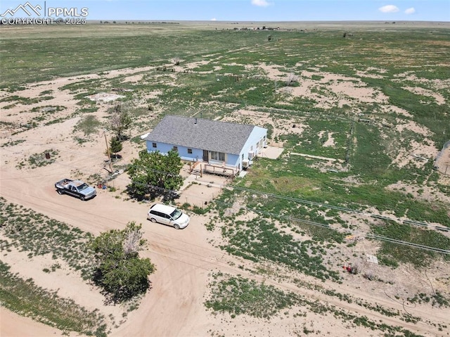 birds eye view of property featuring a rural view