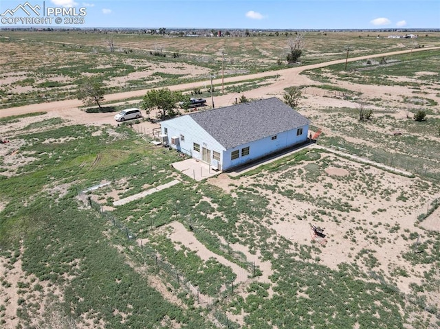 birds eye view of property featuring a rural view