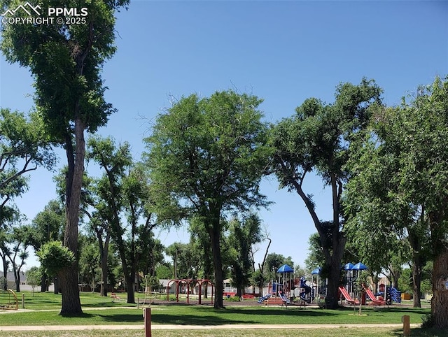 view of community featuring a yard and a playground