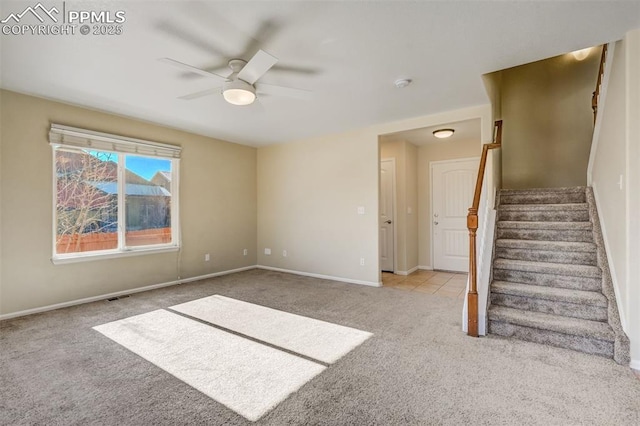 unfurnished room featuring ceiling fan and light colored carpet