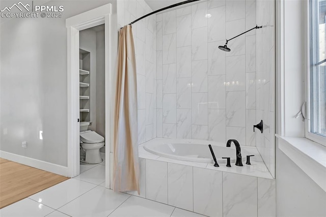 bathroom with toilet, tile patterned floors, and shower / bathtub combination with curtain