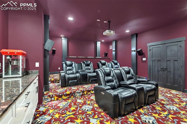 cinema room with light colored carpet