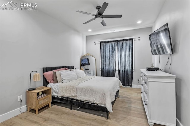 bedroom featuring ceiling fan and light hardwood / wood-style floors